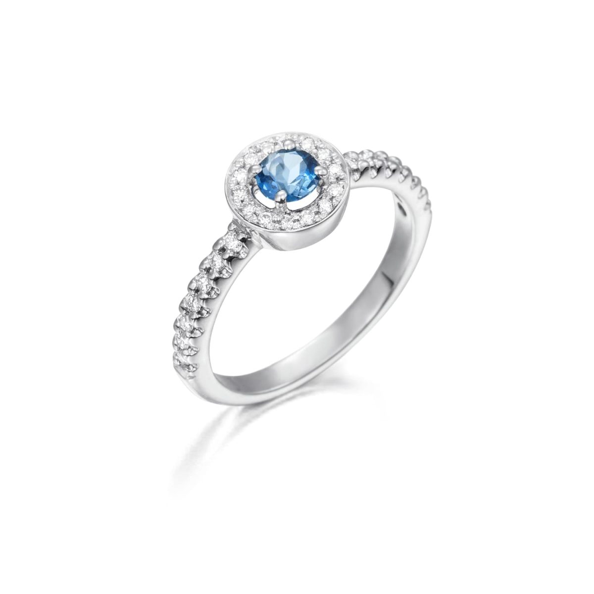 Anillo Wedding Colour Anillo de oro blanco de 18K adornado con 0,22ct de diamantes talla brillante y un topacio azul natural de 0,36ct.